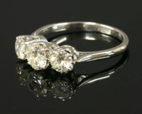 Lot 583 - A graduated three stone diamond ring