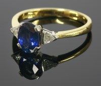 Lot 667 - An 18ct gold sapphire and diamond three stone ring