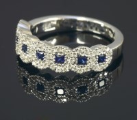 Lot 668 - An 18ct white gold sapphire and diamond half hoop cluster ring