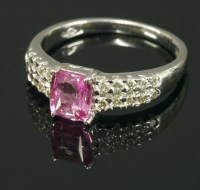 Lot 670 - An 18ct white gold pink sapphire and diamond ring