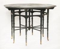 Lot 87 - An ebonised coromandel and inlaid octagonal centre table