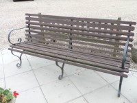 Lot 792 - A wrought iron and slatted garden bench