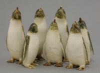 Lot 313 - An amusing colony of bone Penguins
