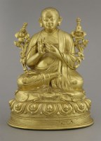 Lot 124 - A gilt bronze Tibetan Figure