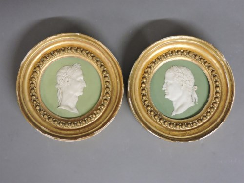 Lot 1204 - A pair of Wedgwood circular green sage Jasper ware panels