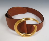 Lot 260 - A Gucci brown leather belt with gold tone single 'G' buckle
