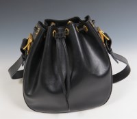 Lot 415 - A Gucci black leather bucket bag with gold tone saddle hardware