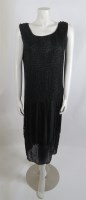 Lot 254 - A 1920s black beaded flapper dress