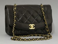 Lot 414 - A vintage Chanel black quilted lambskin small classic flap bag