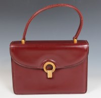 Lot 421 - A Gucci red leather handbag
