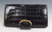 Lot 426 - An Asprey of Bond Street black crocodile skin clutch handbag