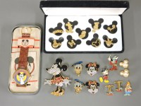 Lot 35 - A collection of Walt Disney gold-plated enamel and paste set jewellery