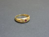 Lot 92 - An Edwardian three stone ruby and diamond star set gypsy ring