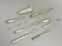 Lot 72 - A collection of white metal mounted sewing tools