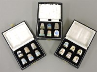 Lot 90 - Three cases of silver and enamel thimbles
