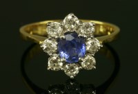 Lot 12 - An 18ct gold sapphire and diamond cluster ring