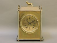 Lot 180 - A late 19th/early 20th century brass mantel clock