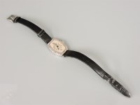 Lot 18 - A ladies Art Deco tonneau shaped mechanical strap watch