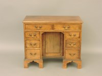 Lot 476 - A George III mahogany kneehole desk