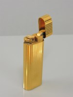 Lot 35 - A gold plated Cartier lighter