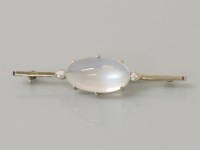 Lot 40 - A white gold Art Deco moonstone and quartz bar brooch
