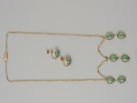 Lot 42 - A gold six stone jade drop necklace and earring matched suite