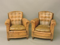 Lot 584 - A pair of leather armchairs