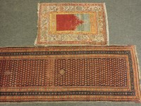 Lot 542 - A wool multi coloured patterned runner