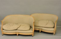 Lot 536 - A pair of beechwood low settees