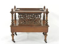 Lot 562 - A Victorian walnut Canterbury