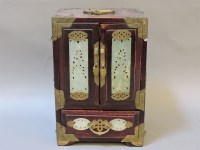 Lot 185 - A Chinese 'jade' mounted wood jewellery cabinet