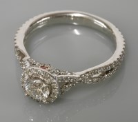 Lot 7 - A white gold diamond set halo cluster ring