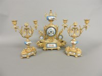 Lot 198 - A Continental gilt metal and porcelain mounted garniture de cheminée