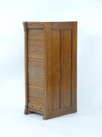 Lot 570 - An early 20th century tambour front filing cabinet