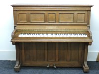 Lot 836 - An oak cased upright overstrung piano