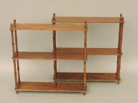 Lot 505 - A pair of three tier wall shelves