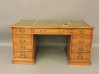 Lot 533 - A reproduction yew wood twin pedestal desk