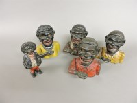 Lot 204 - Four cast iron Negro money boxes