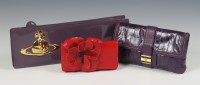 Lot 211 - A Vivienne Westwood purple patent leather long clutch