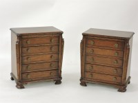 Lot 568 - A pair of reproduction mahogany five drawer chests