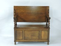 Lot 592 - A 1920s oak monk's bench