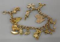 Lot 15 - A gold charm bracelet