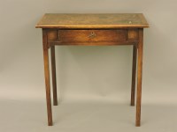 Lot 524 - An early 20th century oak writing table