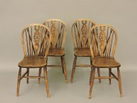Lot 515 - Four ash and elm wheelback kitchen Windsor chairs