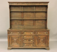Lot 559 - An 18th century style oak moulded front dresser