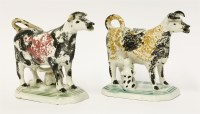 Lot 29 - A near pair of Staffordshire Cow Creamers
