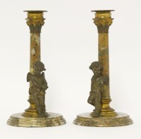 Lot 208 - A pair of gilt metal-mounted hardstone candlesticks