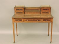 Lot 580 - An Edwardian satin wood cross banded desk