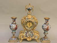 Lot 184 - A late 19th century French champlevé clock garniture