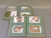 Lot 125 - Two albums of early to mid 20th century postcards